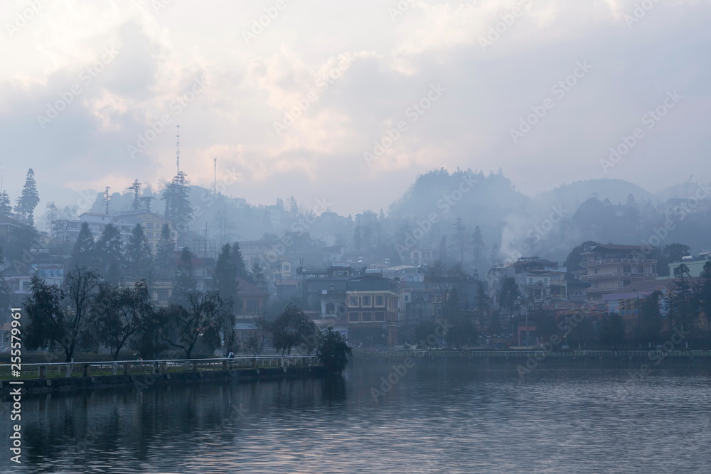 Beautiful dreamy lake view of Sapa city in the late afternoon on a misty day, Sapa, Northern Vietnam 