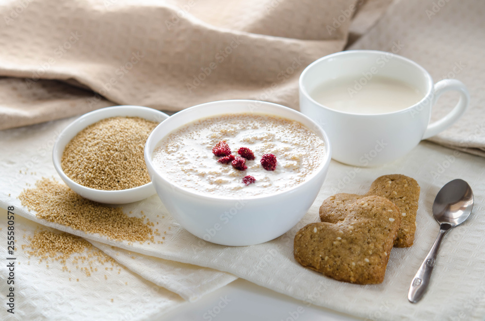 Sesame dry cookies in the form of heart, porridge of amaranth and yogurt, healthy breakfast. Sesame dry cookies in the form of heart, porridge of amaranth and yogurt, healthy breakfast.
