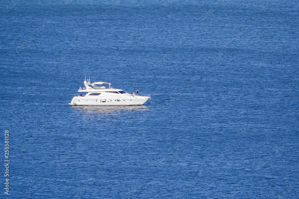 Private motor yacht on the blue sea (copy space)