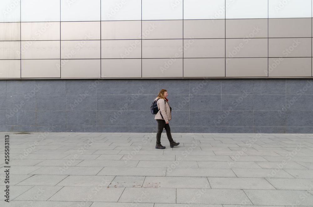 Blonde caucasian woman is walking outdoors Blonde caucasian woman is walking outdoors