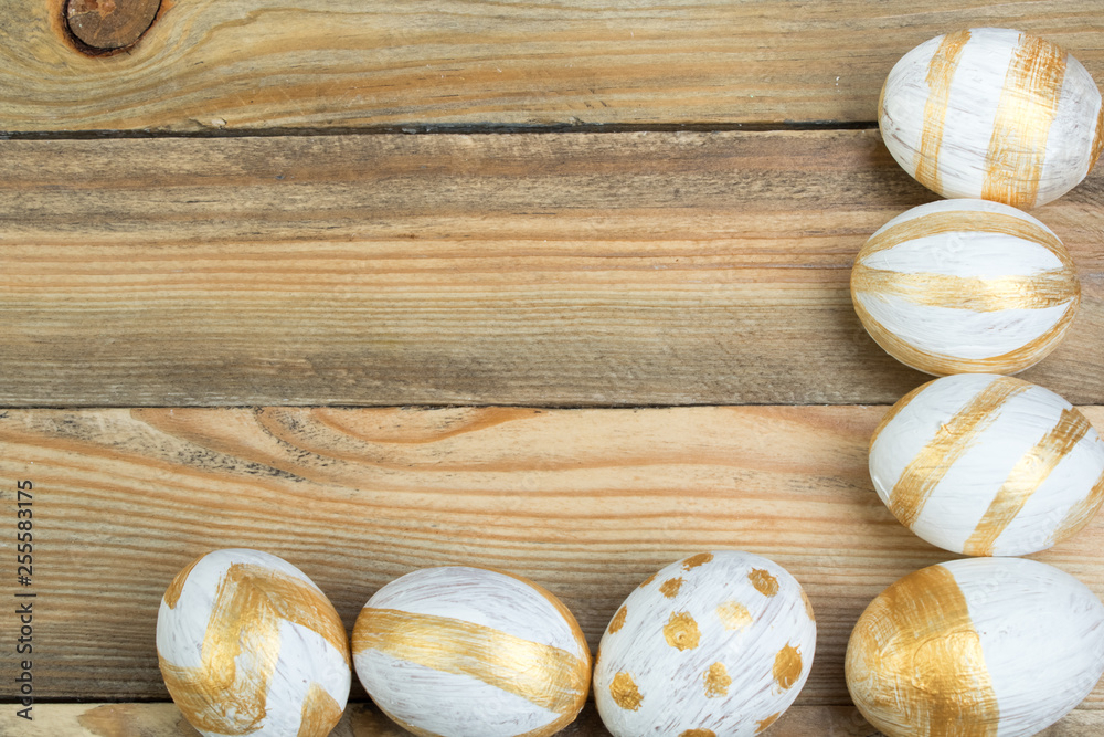 Happy Easter. Painted eggs on wooden table. Top view. Happy Easter. Painted eggs on wooden table. Top view.