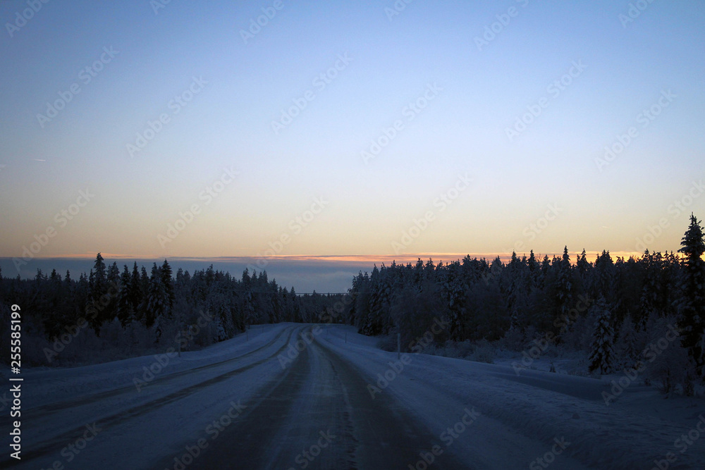 Scenic winter road view, Northern Finland