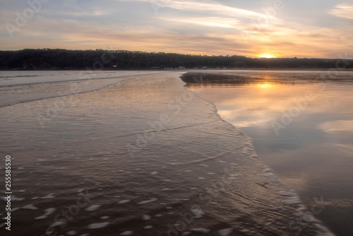 Landscape image of Oxwich Bay at sunset in the Gower Peninsula, South Wales. 