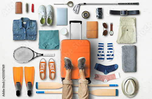 Travel concept with a large suitcase and other accessories photo