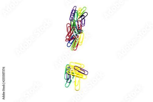 Obraz na płótnie Exclamation mark from color clips, with soft blur at the bottom, on a white background. w salonie