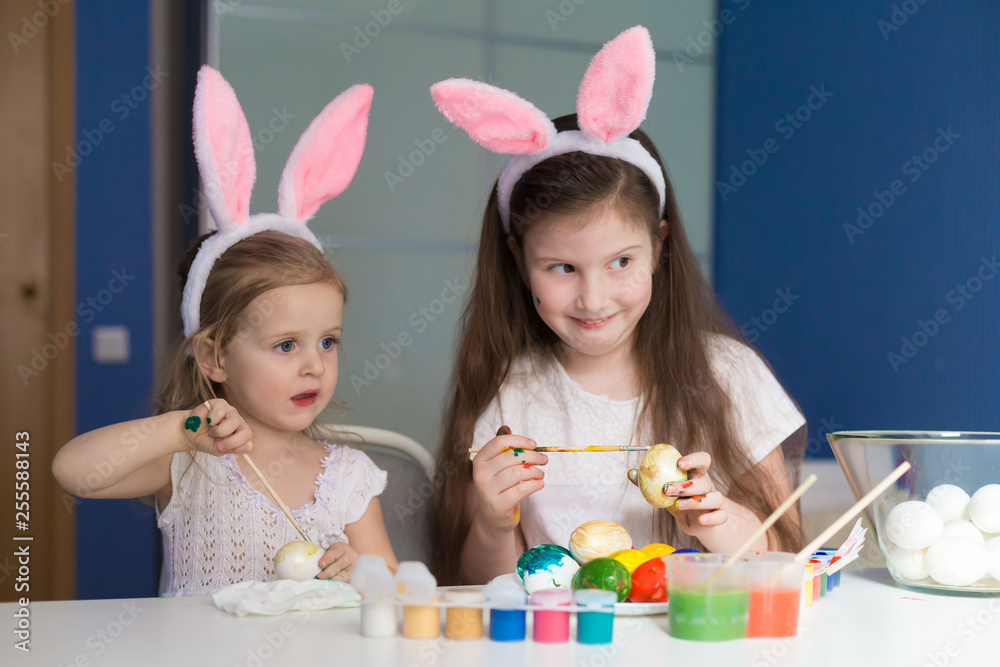 Girls paint easter eggs Girls paint easter eggs