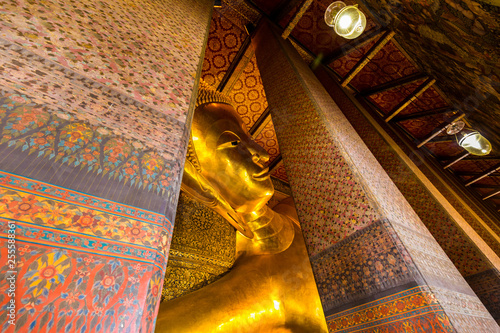 Reclining golden buddha statue at Wat Pho photo