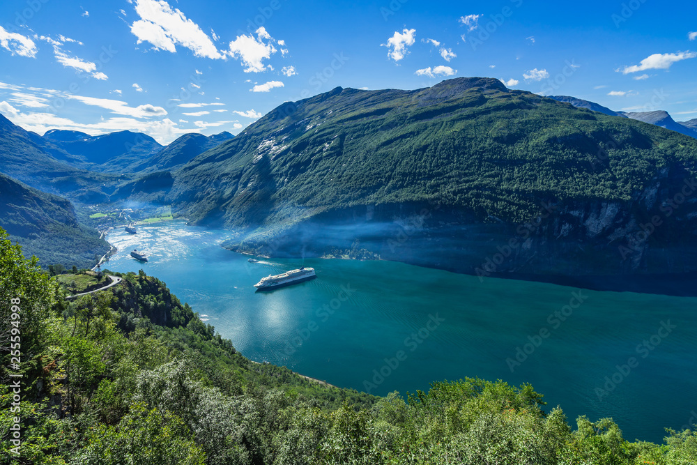 Geirangerfjord full of cruise ship in clear day viewed form Eagle Road viewpoint, More og Romsdal, Norway