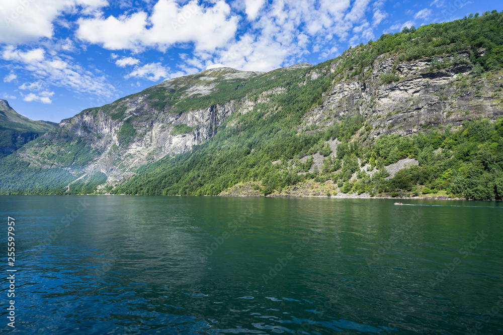 Beautiful landscape of Geirangerfjord in a sunny day viewed from a sightseeing boat, Sunnmore, More og Romsdal, Norway