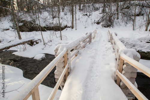 Wooden bridge in the snow. ...