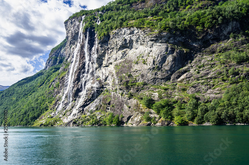 Seven Sisters Waterfall over Geirangerfjord, Norway. It consists of seven separate streams, and the tallest of the seven has a free fall of 250 m