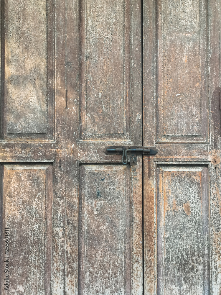 Old metal bolt on the wooden door background. Old metal bolt on the wooden door background.