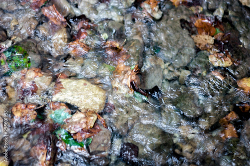 Wet stone pebbles in the river. Pebble and colored pebbles in the water. Stones, Water, Wave, Nature, Pebble, Wet. River water stone