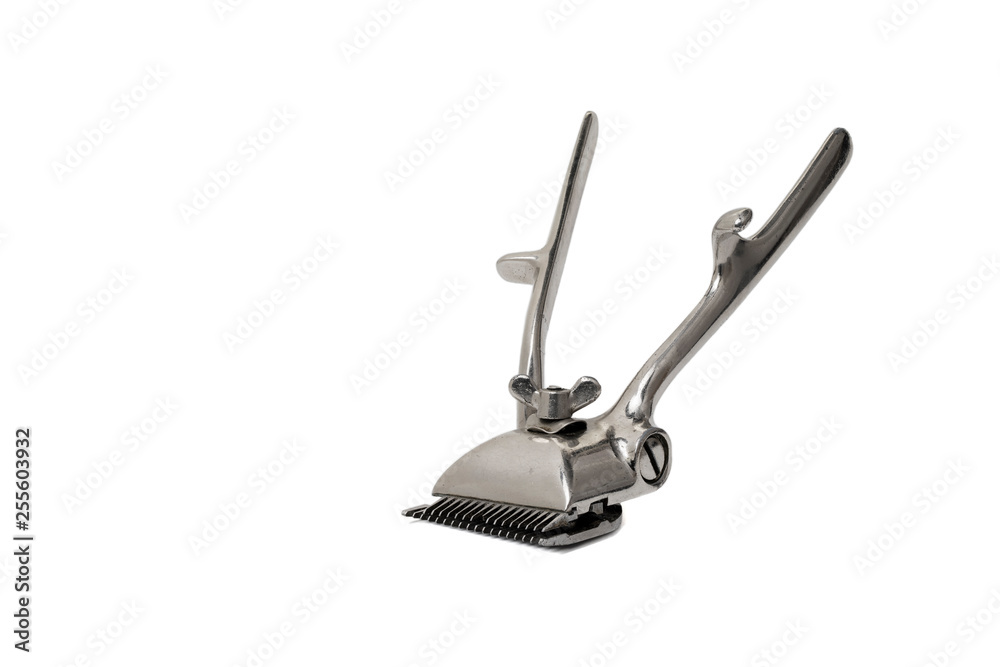 Old manual hair clipper isolated on white background Old manual hair clipper isolated on white background