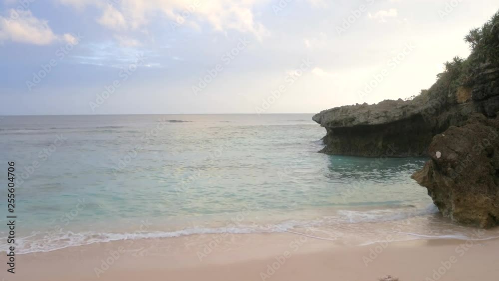White beach with some wind blowing and small wave in summer holiday time in Okinawa, Japan in warming color tone -Sea view White beach with some wind blowing and small wave in summer holiday time in Okinawa, Japan in warming color tone -Sea view