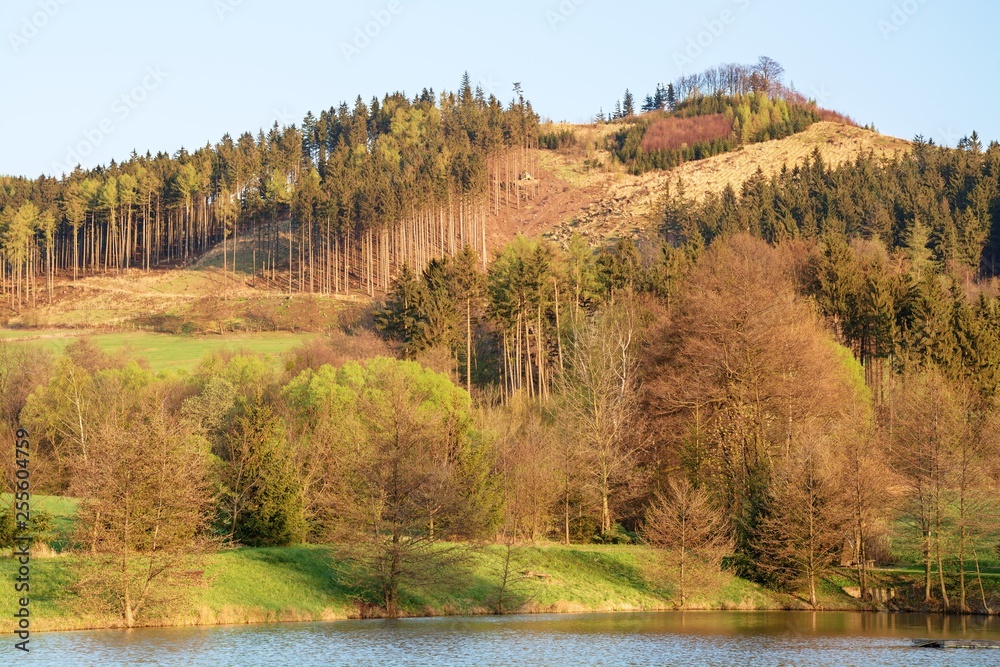 Mountains behind the Kunovice pond at sunset. Moravia. Europe. Mountains behind the Kunovice pond at sunset. Moravia. Europe.