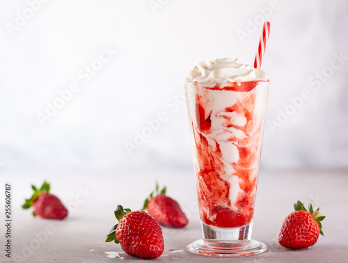 Strawberry milkshake with whipped cream.