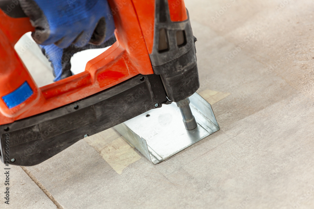 Gas nail gun, cordless tool. Gas nail gun, cordless tool.