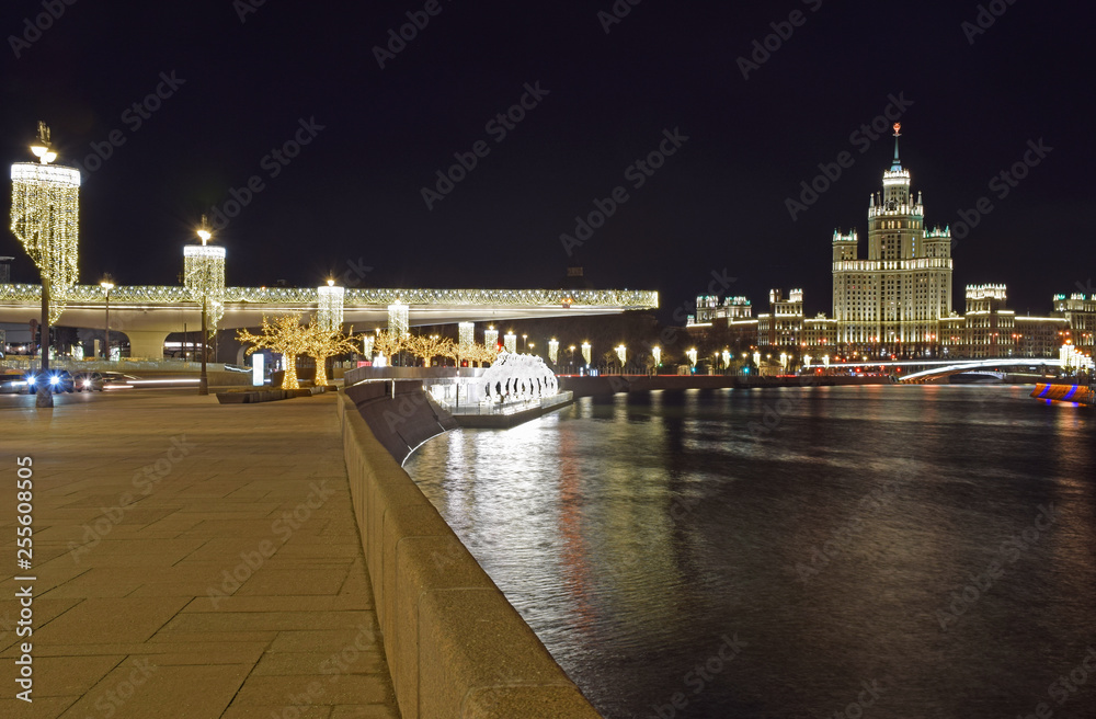 View of the Moskva River and the high-rise residential building from the observation deck of the Zaryadye Park. Russia, Moscow, March 2019