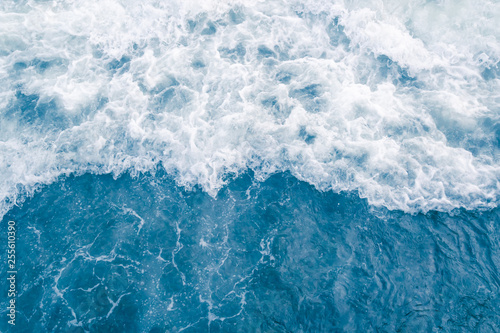 Fotografering Pale blue sea wave during high summer tide, abstract ocean background
