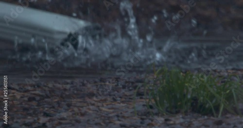 Water Flooding a Downspout In Slow Motion During Rainfall