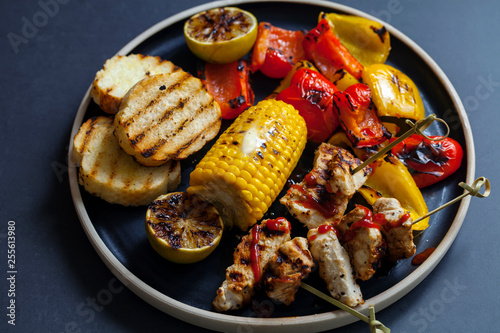 Grilled chicken skewers with peppers and sweetcorn photo