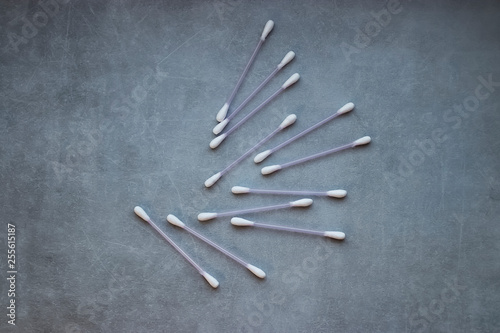 Cotton buds on gray background. Copy space.