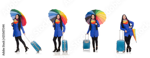 Pretty girl with suitcase and umbrella isolated on white