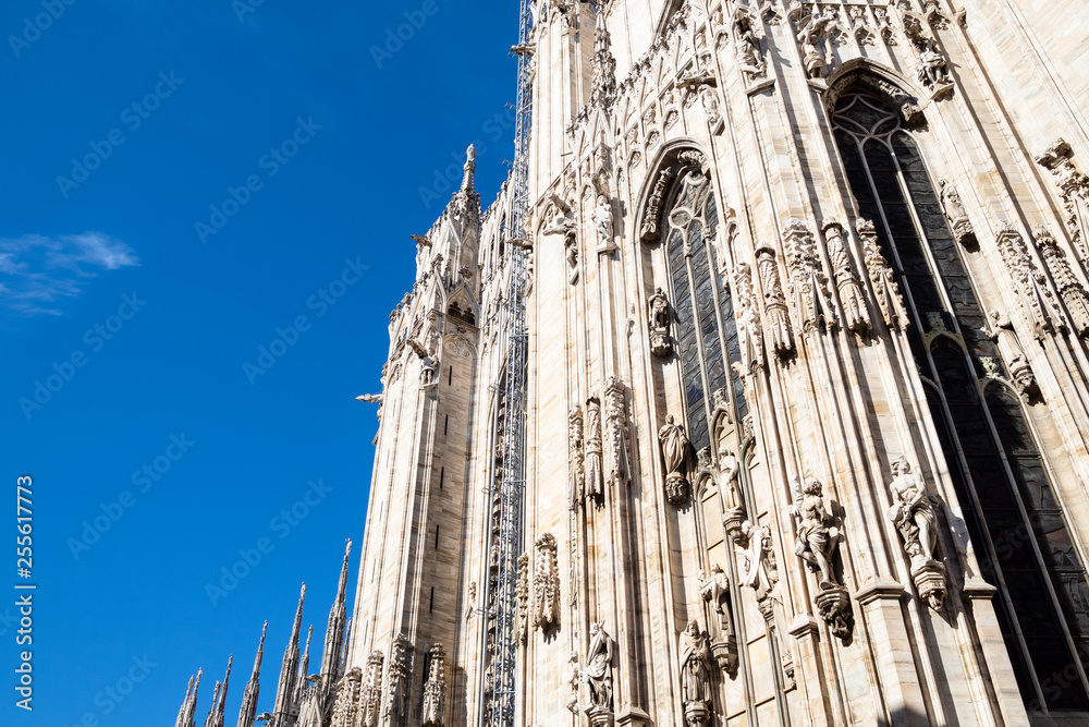 view of facade of Milan Cathedral in midday