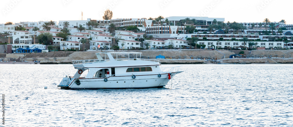 Fototapeta premium White Yacht In Blue Bay