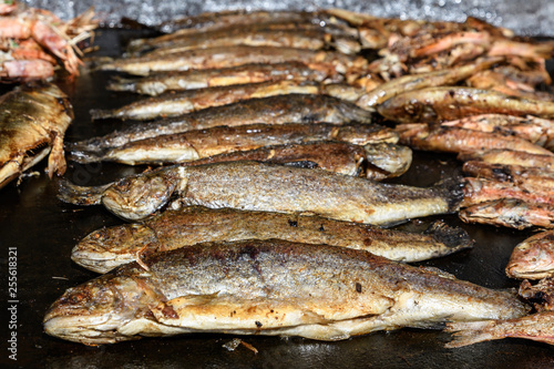 Mackerel fish prepared on hot hood a street food festival, cooked and ready to eat