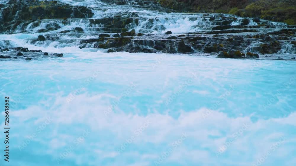 Midfoss waterfall Iceland close up. Spring, blue water. 4K resolution Midfoss waterfall Iceland close up. Spring, blue water. 4K resolution