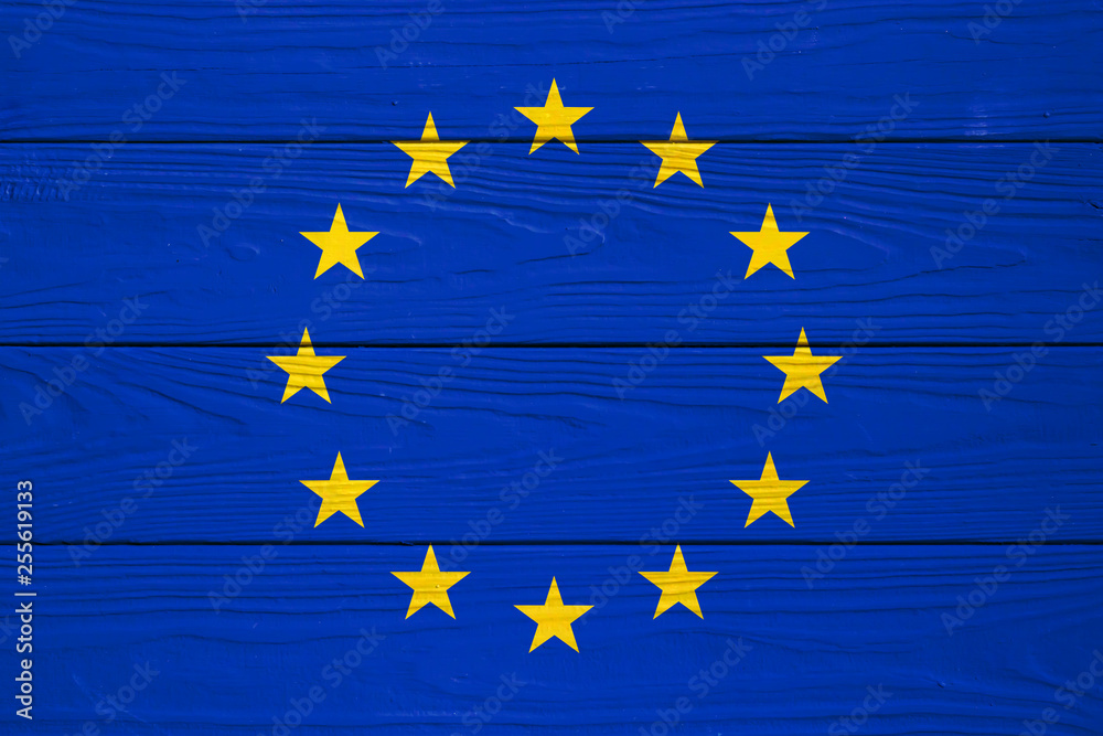 European Union flag on a wooden background European Union flag on a wooden background