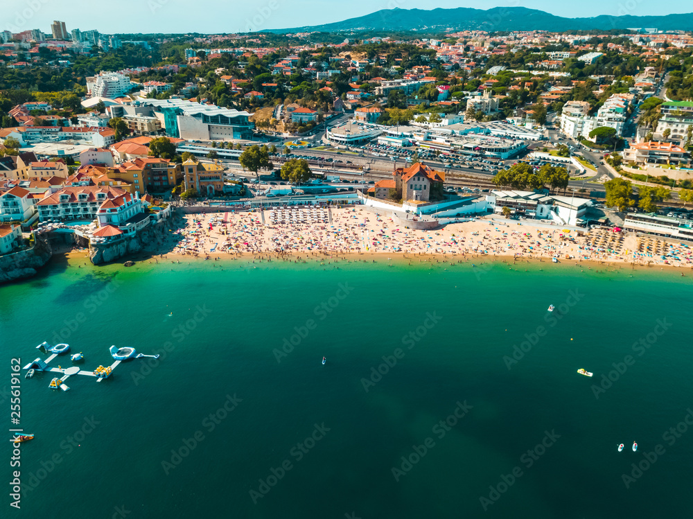 Aerial Summer View Of People Crowd Having Fun On Cascais Beach In Portugal