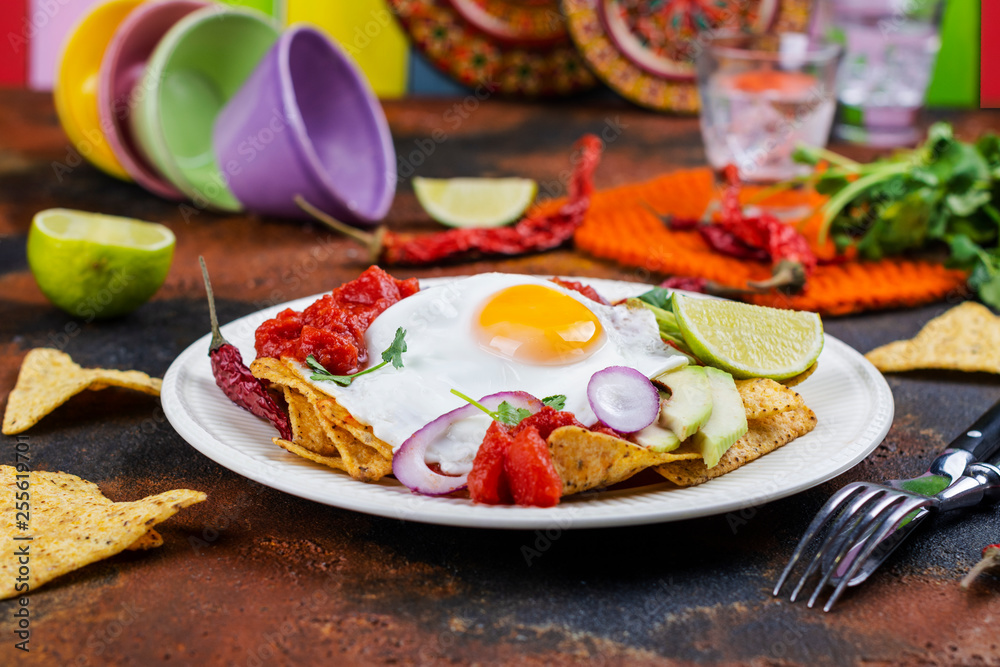 Mexican breakfast - chilaquiles dish Mexican breakfast - chilaquiles dish