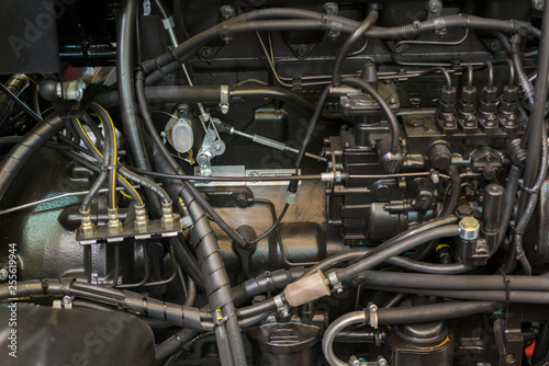 Modern new agricultural diesel tractor engine. Modern new hi-tech engine of loader or small tractor. Top view. The big new engine on a show window