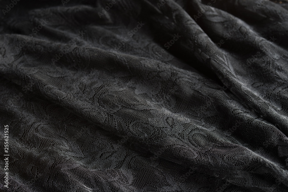 black folded lace textile background texture black folded lace textile background texture