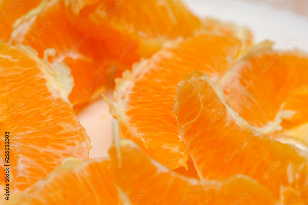 Slice of fresh orange fruit. Macro shoot of fresh orange. Orange background Slice of fresh orange fruit. Macro shoot of fresh orange. Orange background
