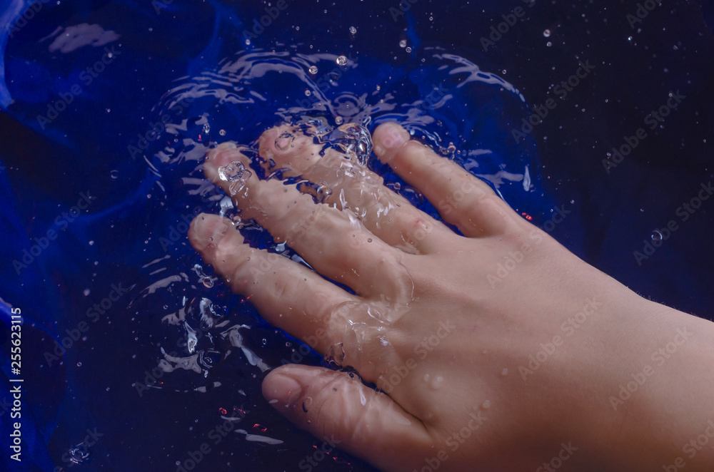 Children's hands against the background of water and white. Children's hands against the background of water and white.