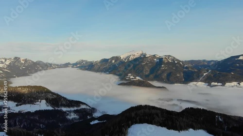 Aerial view of a wonderful sunrise and fog over lake Wolfgansee Salzkammergut Austia photo