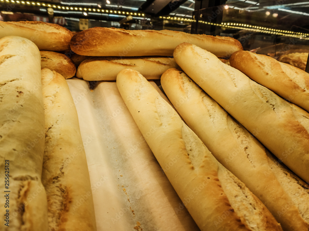 Fresh tasty loaves on the counter in the store Fresh tasty loaves on the counter in the store
