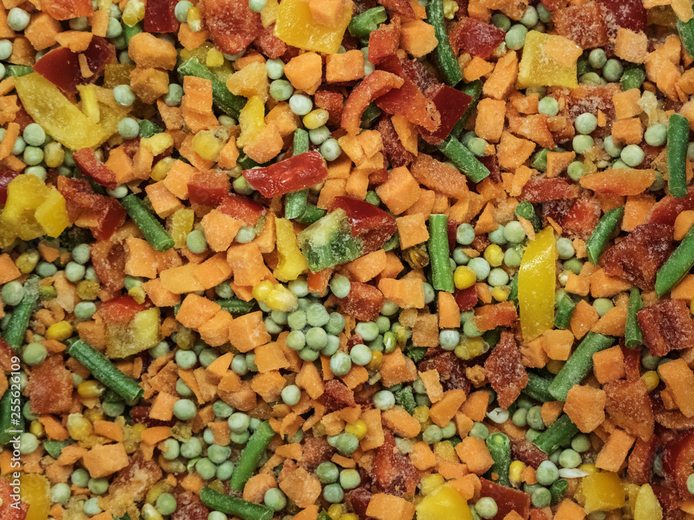 Frozen vegetable mix in a fridge in the store Frozen vegetable mix in a fridge in the store