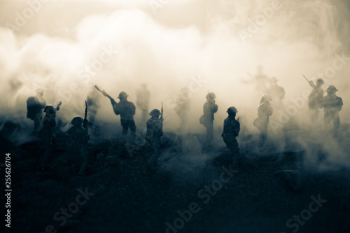 War Concept. Military silhouettes fighting scene on war fog sky background, World War Soldiers Silhouettes Below Cloudy Skyline At night. Attack scene. Armored vehicles. Tanks battle. Decoration