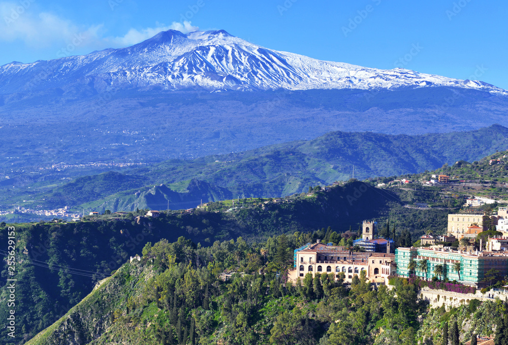 Mount Etna volcano viewed from the town and countryside of Taormina in Sicily, Italy