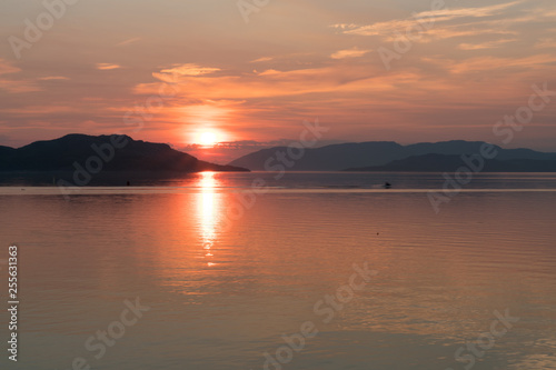 The midnight sun, photographed in Kirkenes, Norway on the 19th of July 2018. photo