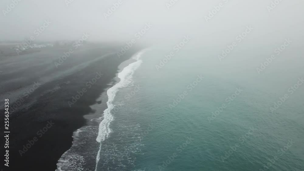 Aerial view green wave hit the black sand at seaside at Kaikoura, South Island, New Zealand. Aerial view green wave hit the black sand at seaside at Kaikoura, South Island, New Zealand.