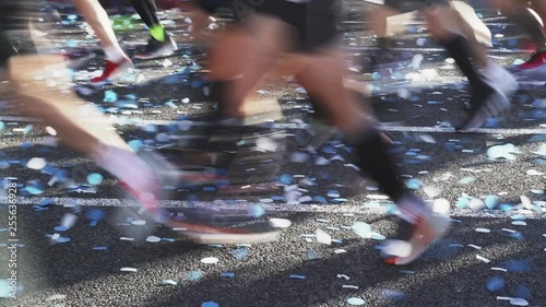 People are take part in the annual spring mass marathon race on the blooming streets of the historic part of Barcelona