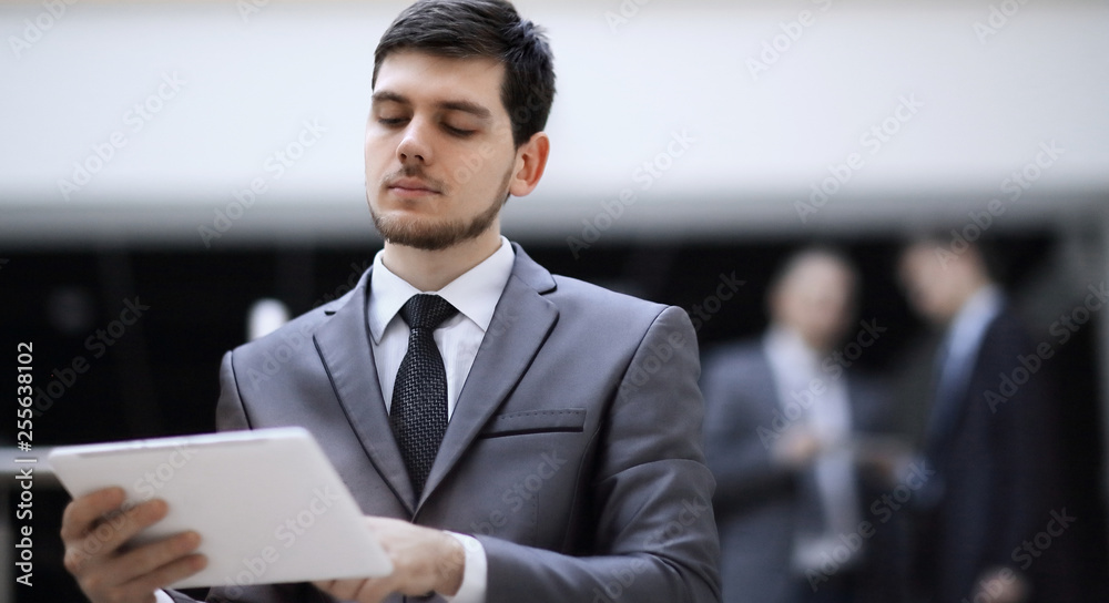 portrait of handsome businessman on blurred office background portrait of handsome businessman on blurred office background