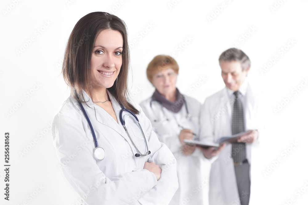 confident female doctor therapist on blurred background of colleagues confident female doctor therapist on blurred background of colleagues