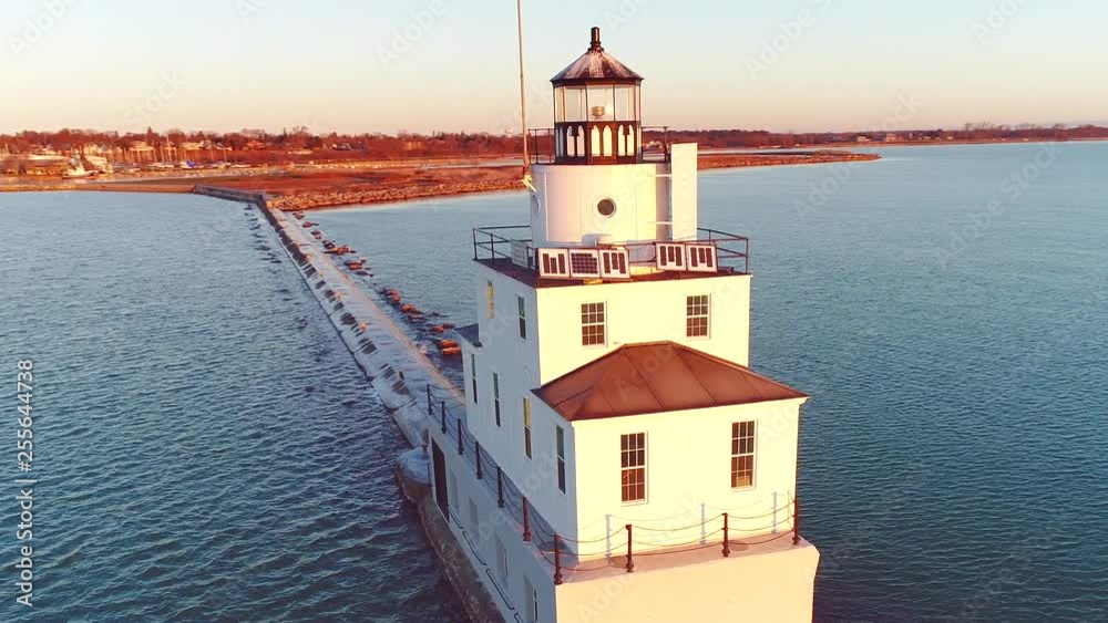 Scenic lighthouse on Lake Michigan at sunrise, aerial view. Scenic lighthouse on Lake Michigan at sunrise, aerial view.